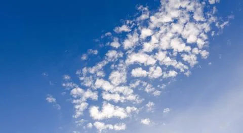 Clouds texture sky background blue. Bright soft clouds white pattern. Daytime Stockfoto's