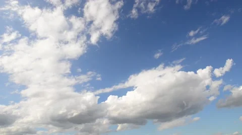 Clouds then plane flies across the sky Stock Footage