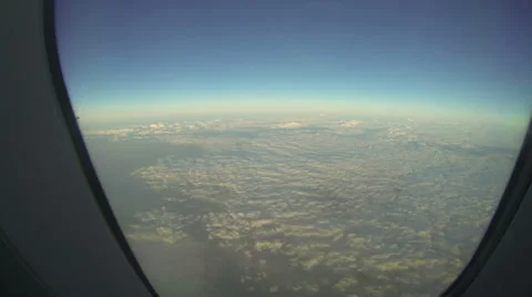 Clouds through an airplane window Stock Footage 31739014