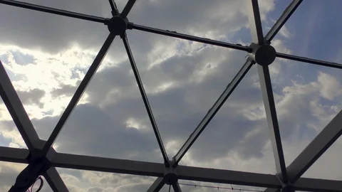 Clouds through metal grid Stockbeeldmateriaal 91250885