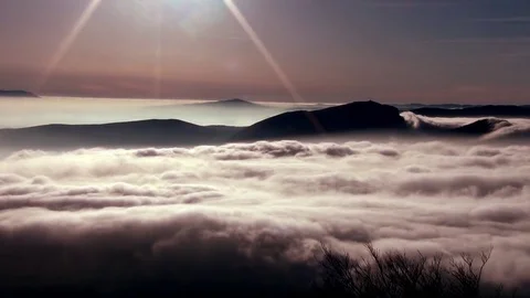 Clouds through the mountain Stock Footage