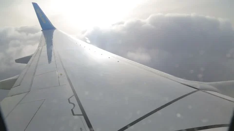 Clouds through the window of a jet plane Stock Footage 89329883