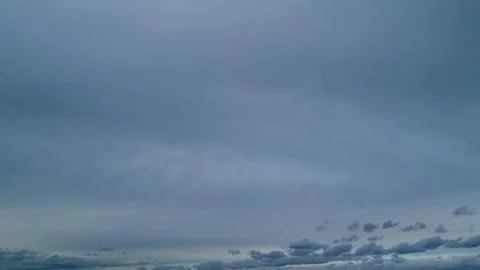 Clouds before thunder storm coming. Dramatic cloudy rainy sky. Timelapse. Stock Photos