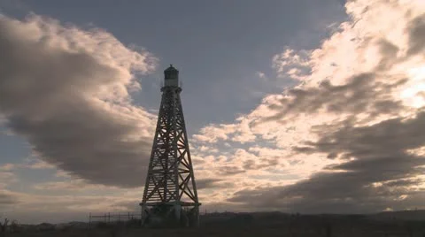 Clouds time lapse behind light beacon Stock Footage 22327457