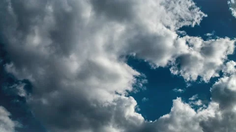 CLOUDS TIME LAPSE, BUILDING MOTION CLOUD WITH BLUE SKY. Stock Footage 160237795