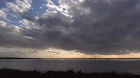 Clouds time lapse from dark to light blue sky depression lifting 4K Stock-Footage 143320614