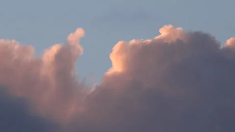 Clouds time lapse from dark to light blue sky lifting sun 4K Stockbeeldmateriaal 169867583
