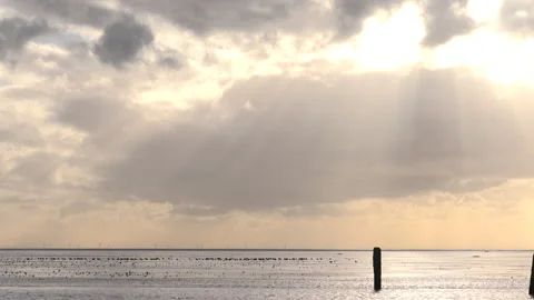 Clouds time lapse moving in blue sky over estuary sunset 4K Video stock 143291018