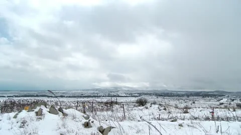Clouds time lapse over snow Stock Footage 11118609