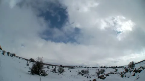 Clouds time lapse over snow Stock Footage 11118682