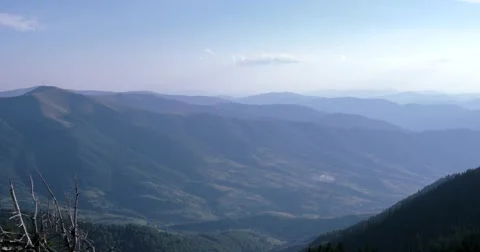 Clouds Time Lapse Pan Over Mountain Range Vídeo Stock 65411931