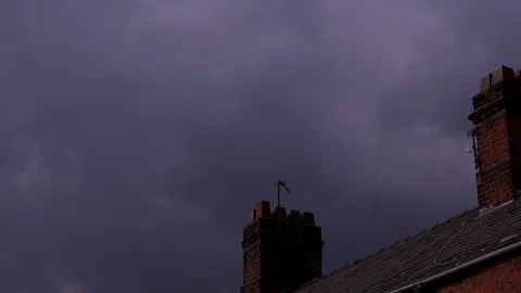 Clouds time lapse storm above home and chimney on house 4K Видео 129649404