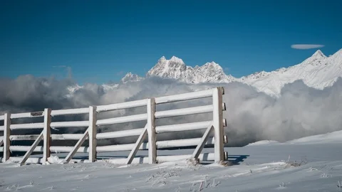 Clouds Timelapse and Snowy Mountains at ski resort Stock Footage 98981472
