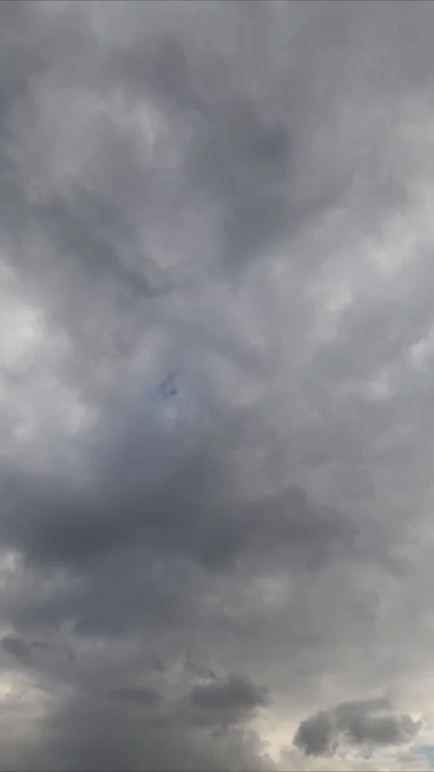 Clouds timelapse clearing sky with blue scattered gaps revealing pale blue, soft Stock Footage 333942163