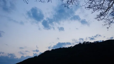 Clouds timelapse from day to night over hill 库存影片 98184916