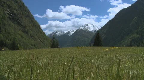 Clouds Timelapse from a green meadow in the mountains Stock Footage 55509085