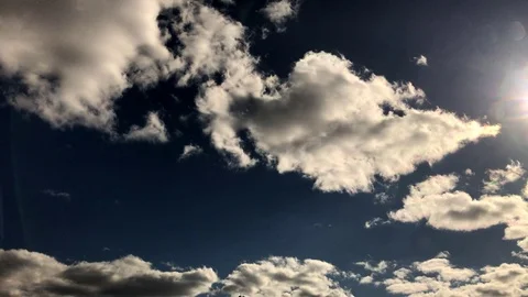 Clouds timelapse with lens flares Video stock 74497382
