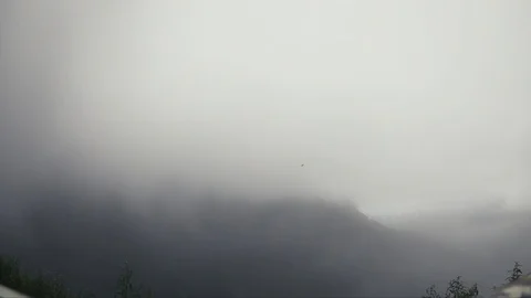 Clouds timelapse over mountains Stock Footage 117335984