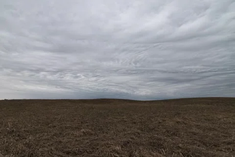 Clouds timelapse over Spring or Fall Field, hills under stormy weather Vídeo Stock 307366027
