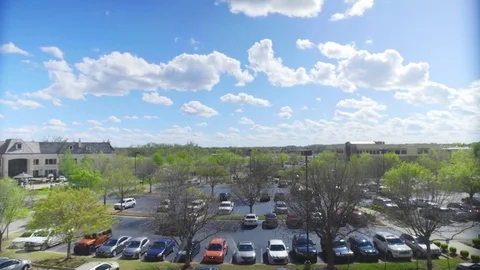 Clouds timelapse over a street and parking lot in Oklahoma City Stock Footage 85137391