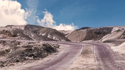 Clouds timelapse over a winding desert road in egypt Stock Footage 337298975