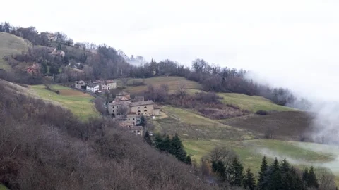 Clouds timelapse as sea waves on rural historical buildings Stock Footage 264052748