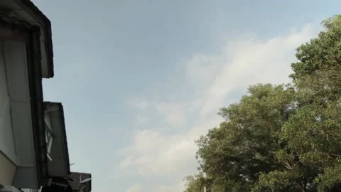 Clouds timelapse view with houses Video stock 158554695