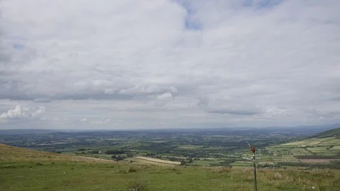Clouds timelaspe over lush greenery in Ireland Stock Footage 93704211