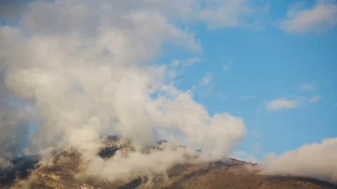 Clouds on the tops of mountains. Cloud formation. Time-lapse Stock Footage 73215978