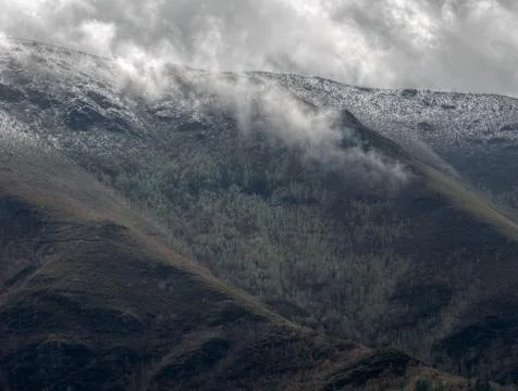 The clouds touch the peaks of the Serra do Courel Stock Photos