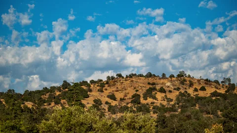 Clouds traverse behind the Golden Hills of California Time lapse Stock Footage 283544902