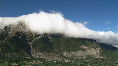 Clouds Tumbling Down Mountain Sides Stock Footage 65258839