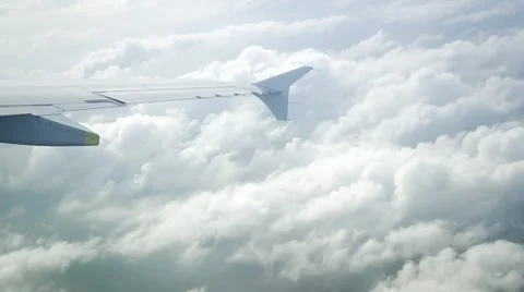 Clouds under a wing (window view) Video stock 8651225