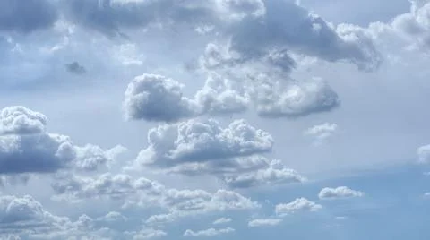 Clouds of various sizes floated in the sky in the afternoon. Stock Photos