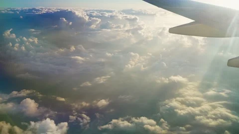 Clouds view from an airplane with an airplane wing Stock Footage 239546069