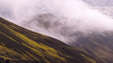Clouds by volcanic mountain formations in Iceland, aerial parallax Stock Footage 339755992