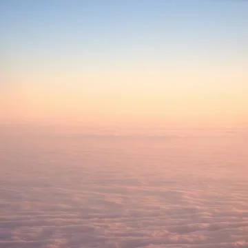 Clouds watched from an airplane window Stock Photos