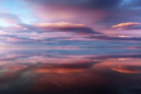Clouds with water reflections Stock Photos