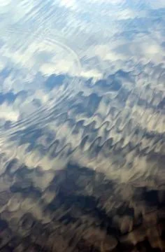 Clouds water ripples Stock Photos