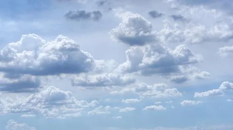 The clouds were slowly blown by the wind. on the bright blue sky Stock Photos