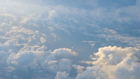 Clouds while flight.View through an airplane window. 库存影片 76380532