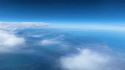 Cloudscape from an airplane window over the Atlantic at midday Video stock 264055083