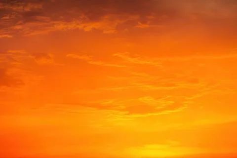 Cloudscape and dramatic orange sky, sunrise shot Stock Photos