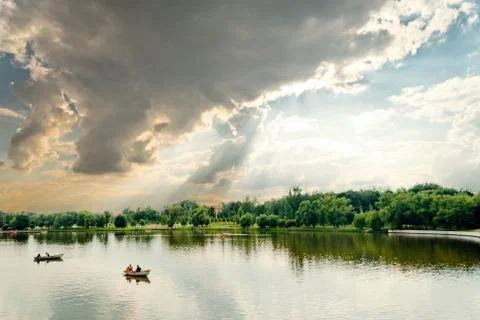Cloudscape and pond witn boats in Tsaritsyno park in Moscow, Russia Stock Photos