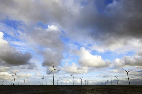 Cloudscape and wind-turbines Stock Photos