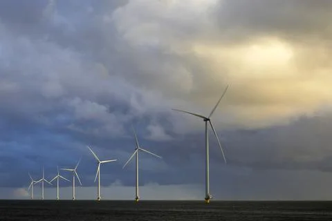 Cloudscape and wind-turbines Stock Photos