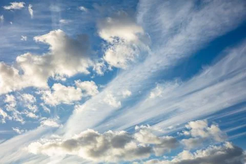 Cloudscape background. View out of an airplane window. Stock Photos