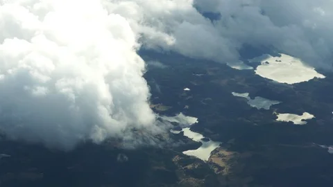 Cloudscape between airplane and land Stock Footage 128873272