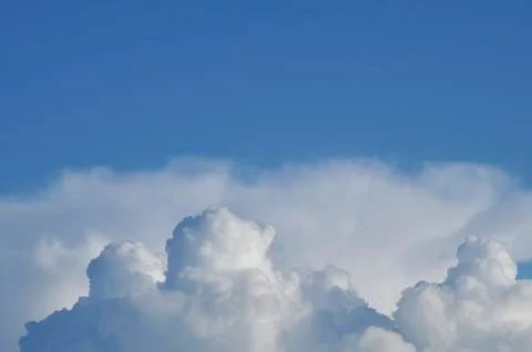 Cloudscape. Blue sky and white cloud. Sunny day Stock Photos