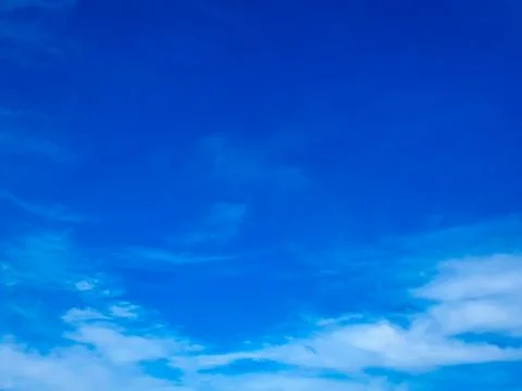 Cloudscape with blue sky and white clouds Stock Photos